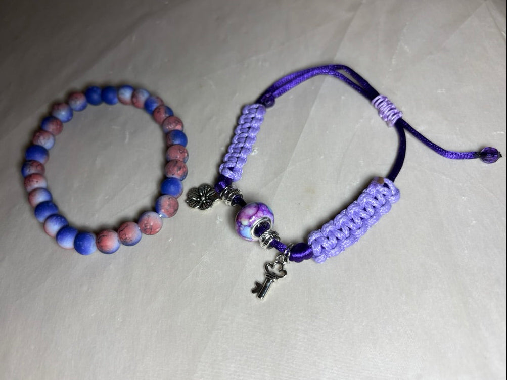 Two bracelets with beads and charms 