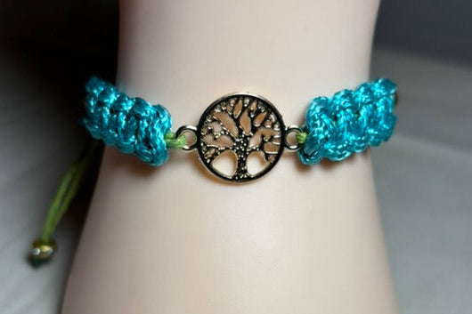 Turquoise braided bracelet with a tree-of-life charm