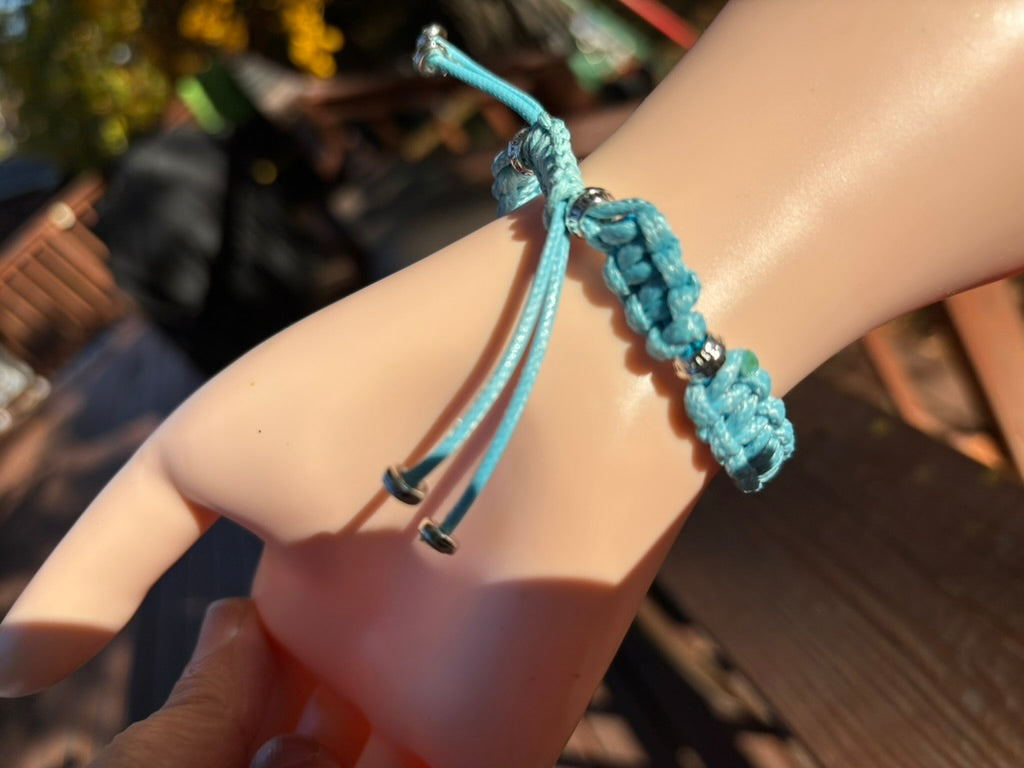 Turquoise braided bracelet on a wrist 