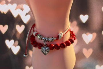Red beaded bracelet with heart charm