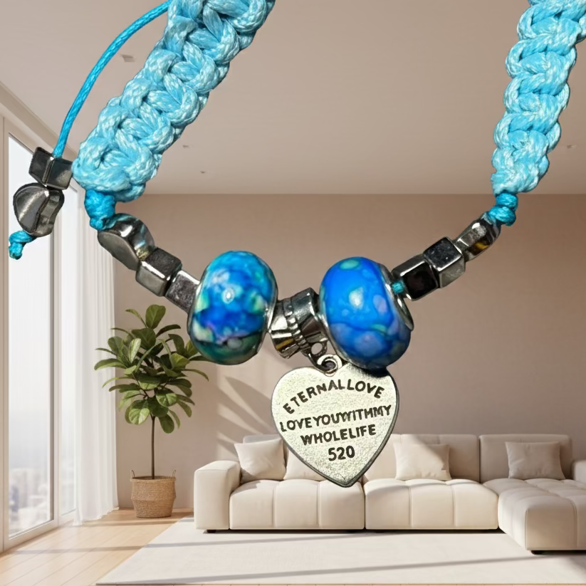 Blue beaded necklace with a heart-shaped charm