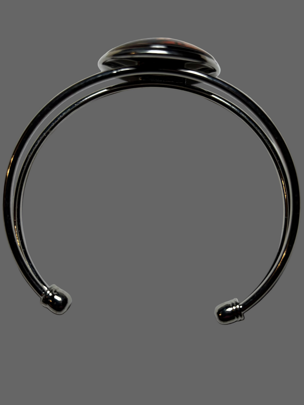 Silver bracelet on a light gray background