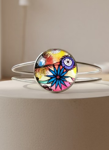Colorful floral design bangle on a beige surface