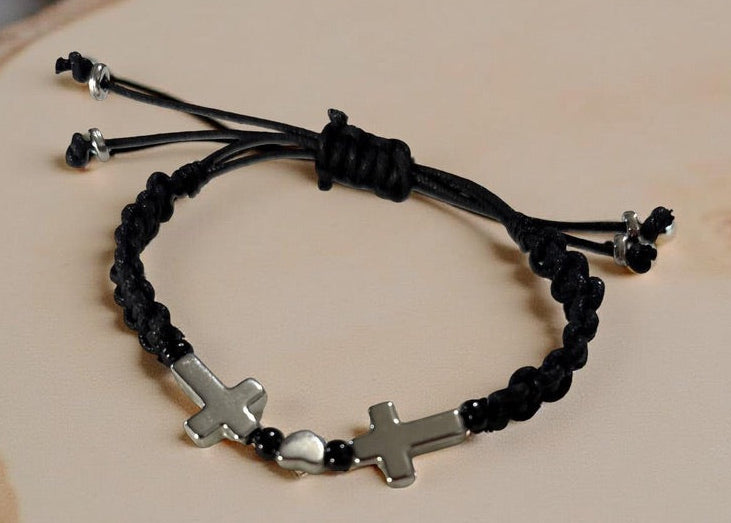 Braided Bracelet In Black And Silver Displaying Silver Color Cross And Heart