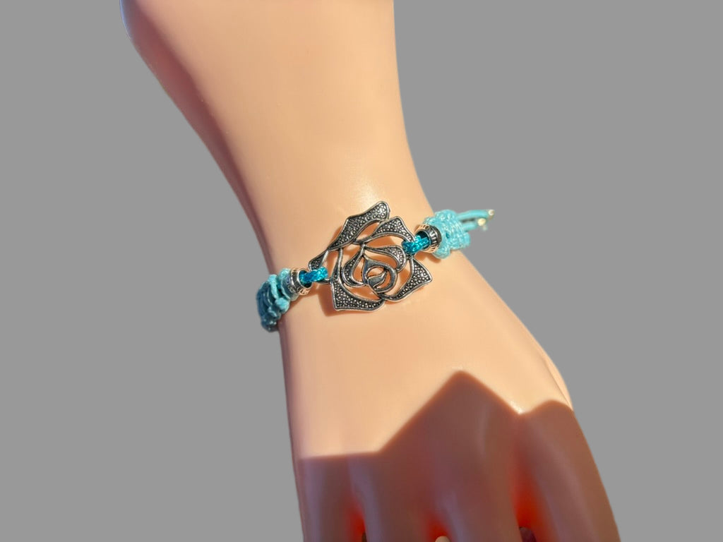 Braided Bracelet With Leather Cord Displaying A Metal Flower