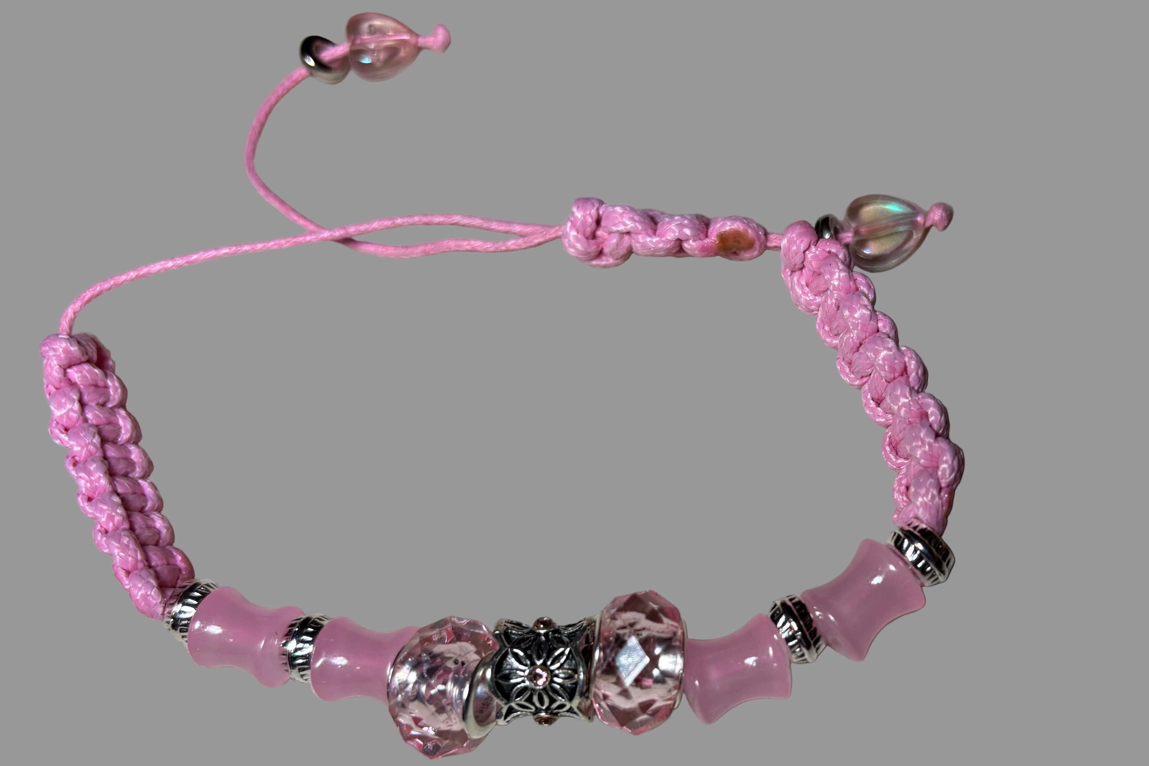 Pink beaded bracelet with silver accents 