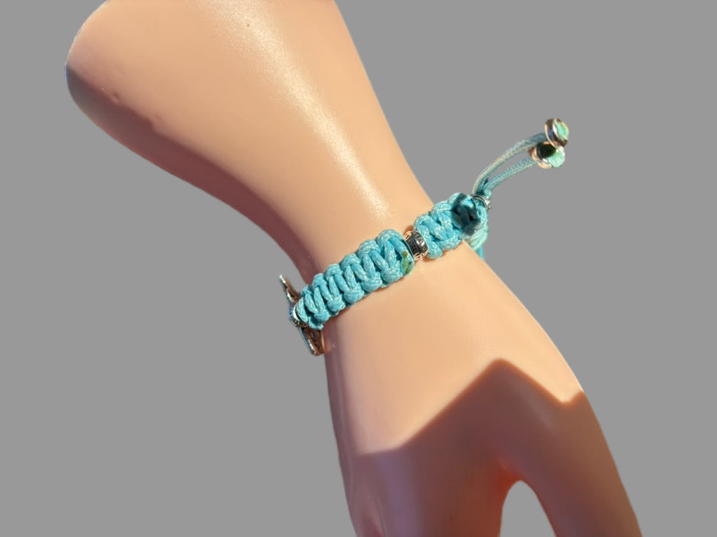 Turquoise braided bracelet on a mannequin wrist