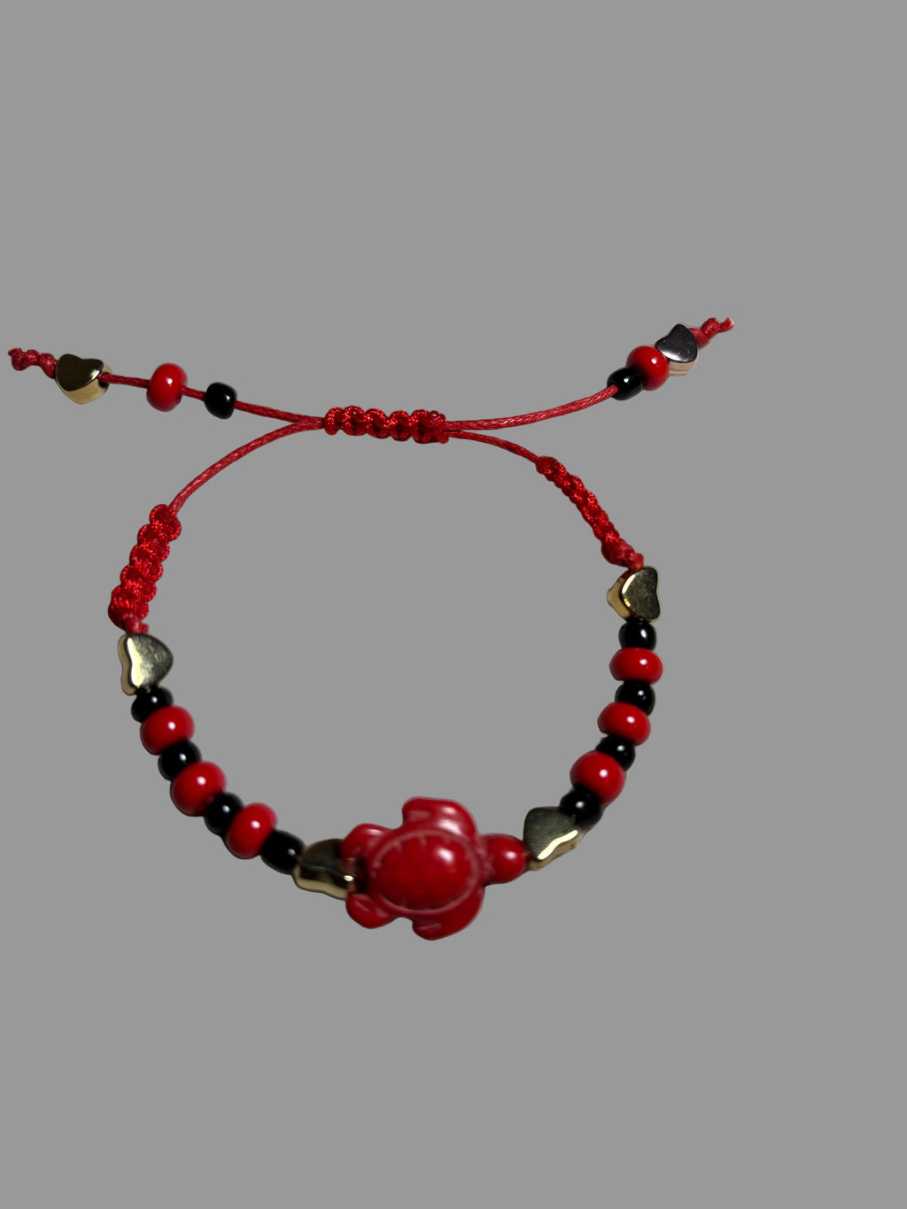 Bracelet with red, black, and gold beads 