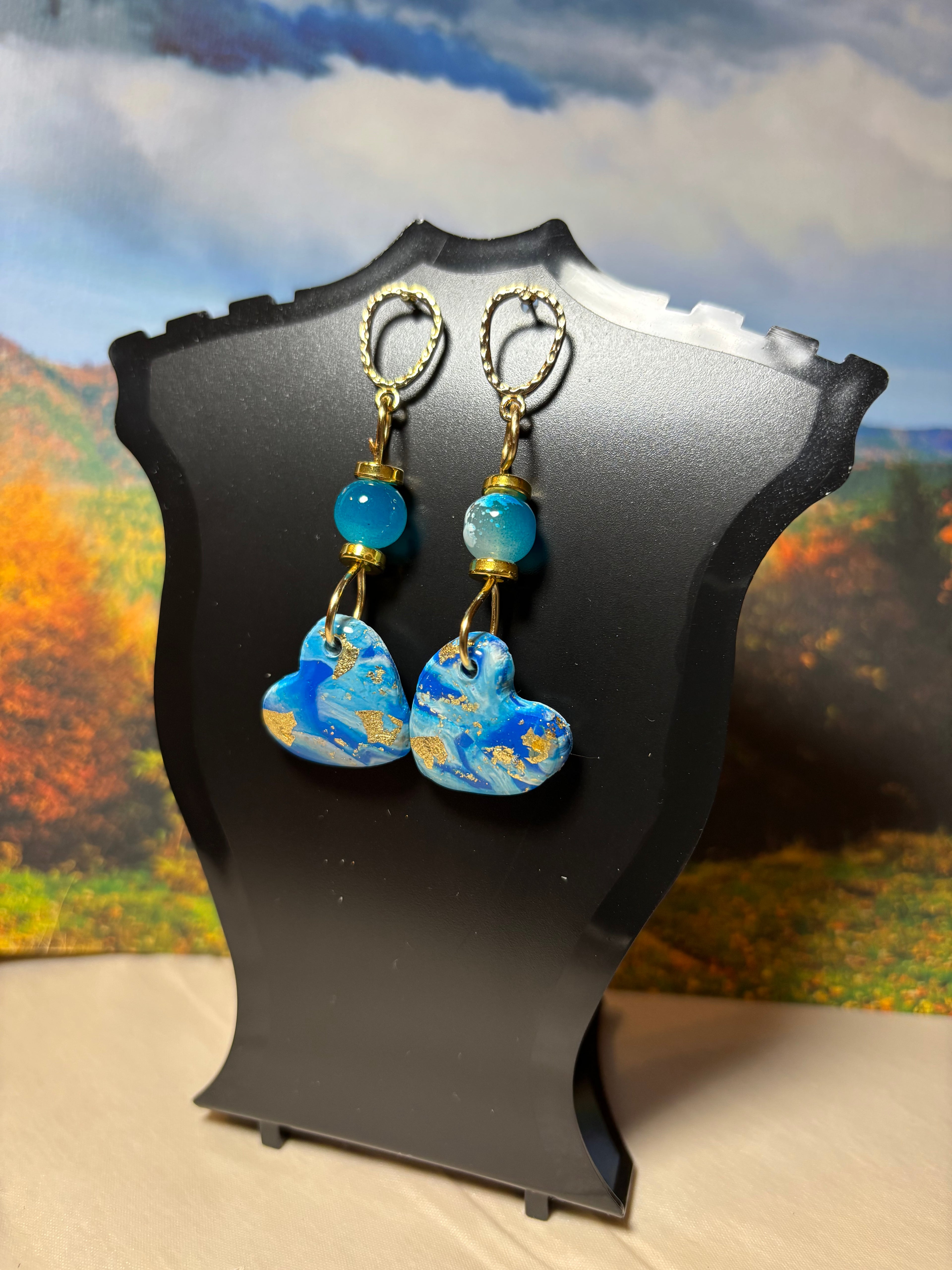 Pair of heart-shaped earrings with blue and gold 